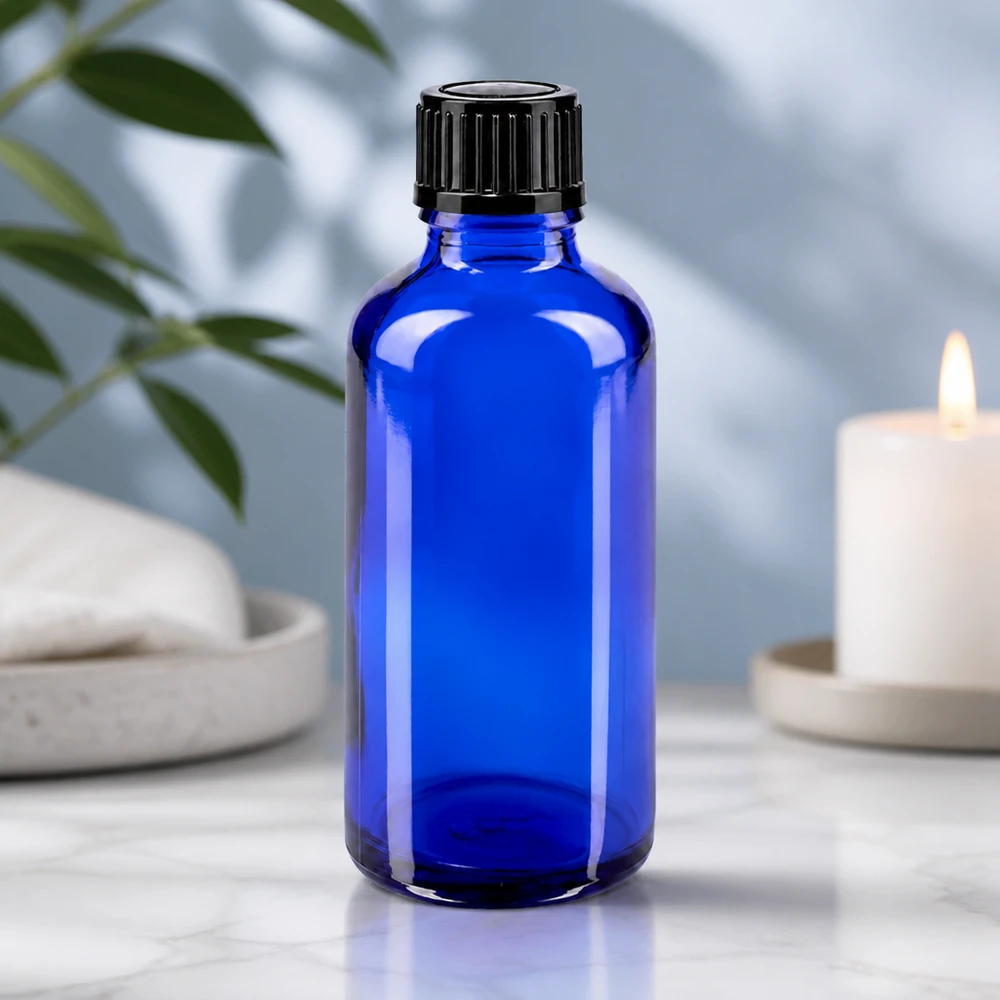 Flacon à pharmacie bleu 50ml bouchon compte-gouttes 1mm noir std Flacon compte-gouttes de 50 ml en verre de pharmacie bleu cobalt, muni d'un bouchon à vis noir à l'épreuve des enfants