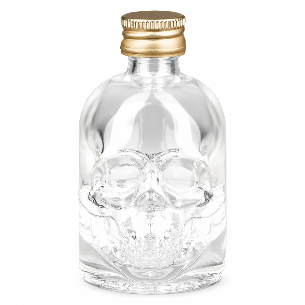 Bottiglia in vetro da 50 ml Hector con tappo a vite oro UNiTWIST® Bottiglia in vetro Hector da 50 ml con design a teschio e tappo a vite UNiTWIST dorato per liquori e bevande