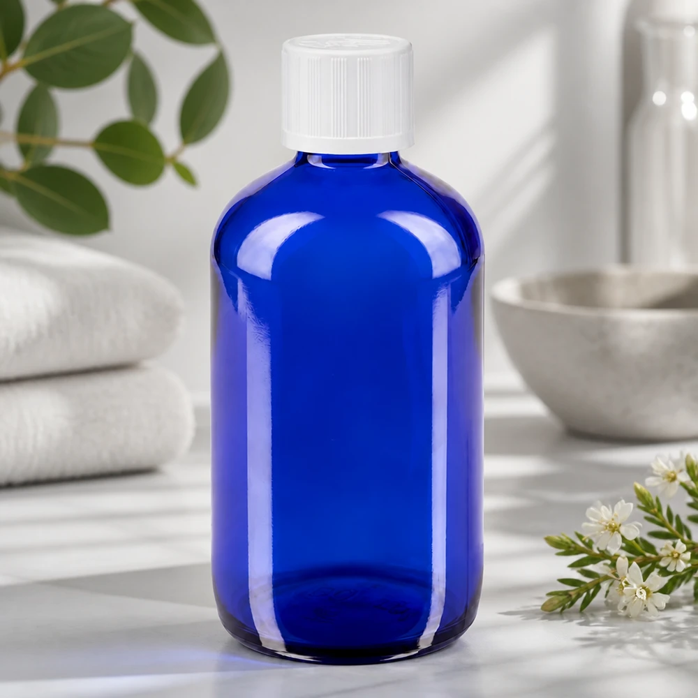 Flacon de pharmacie bleu 100ml bouchon compte-gouttes blanc sécurité enfant std Flacon en verre bleu transparent de 100 ml, muni d'un bouchon de sécurité enfant blanc et d'un compte-gouttes de 1,2 mm