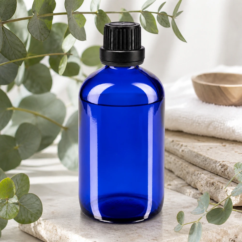 Flacon en verre bleu de 100 ml avec bouchon à vis noir et compte-gouttes pour huiles essentielles