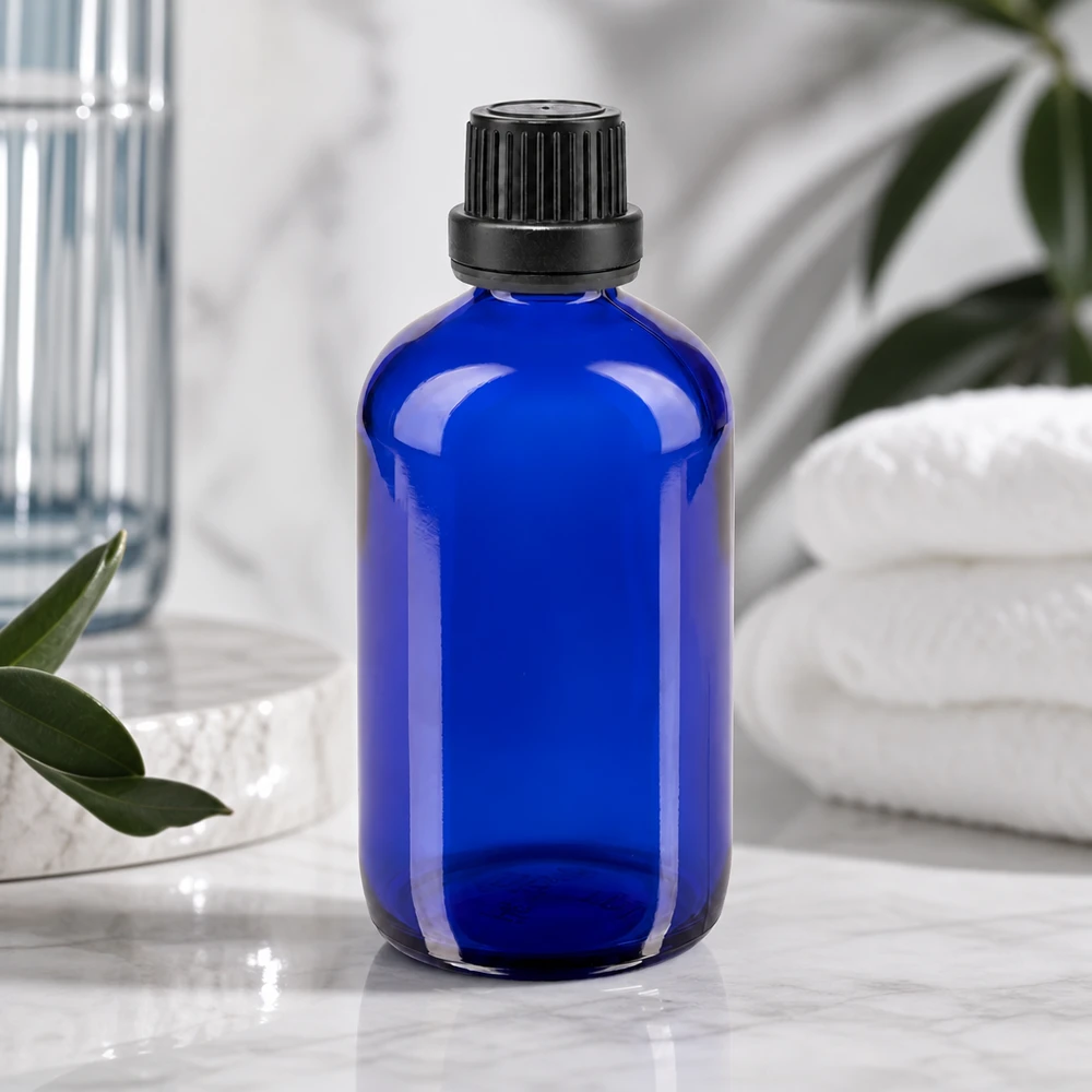 Apothekenflasche blau 100ml Schraubverschluss schwarz Dichteinlage Originalitätsverschluss Blaue 100ml Glasflasche mit schwarzem Kunststoffdeckel ideal zur Aufbewahrung von Ölen