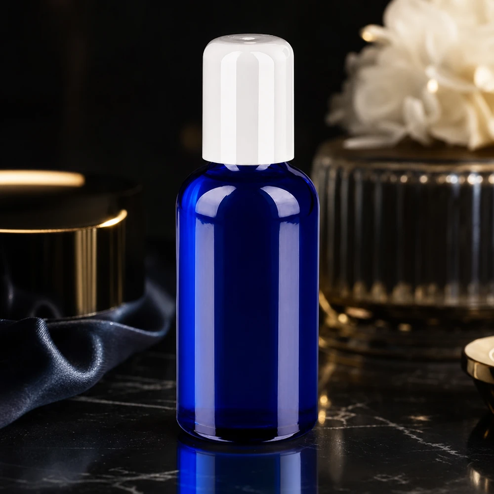 Contenitore roll-on da 50 ml in vetro robusto di colore blu intenso con tappo igienico bianco