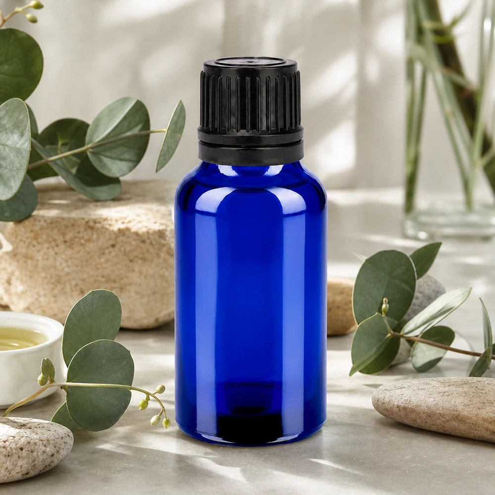 Piccola bottiglia di vetro blu da 20 ml con tappo nero, perfetta per cosmetici e sieri fai da te