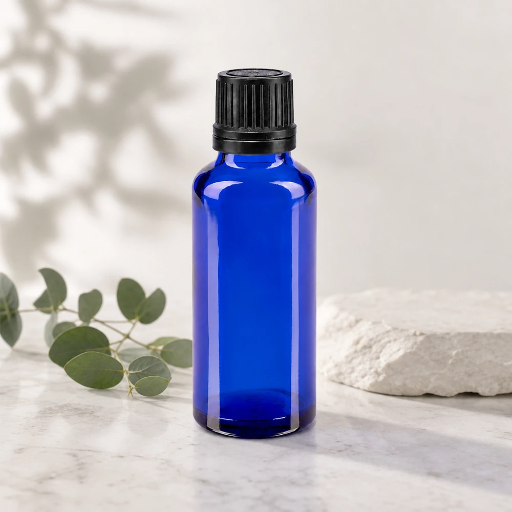 Flacon pharmaceutique en verre bleu de 30 ml, muni d'un bouchon à vis noir et d'un compte-gouttes