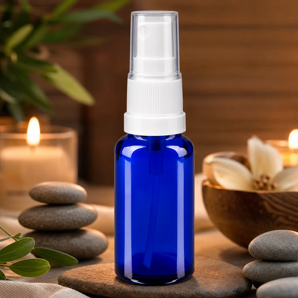 Kobaltblaue 20ml Glasflasche mit Feinzerstäuber und Schutzkappe für Aromatherapie-Anwendungen