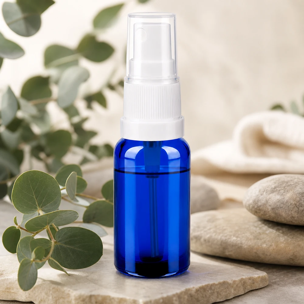 Flacone spray in vetro di alta qualità da 20 ml in blu con spruzzatore a pompa bianco per prodotti di bellezza