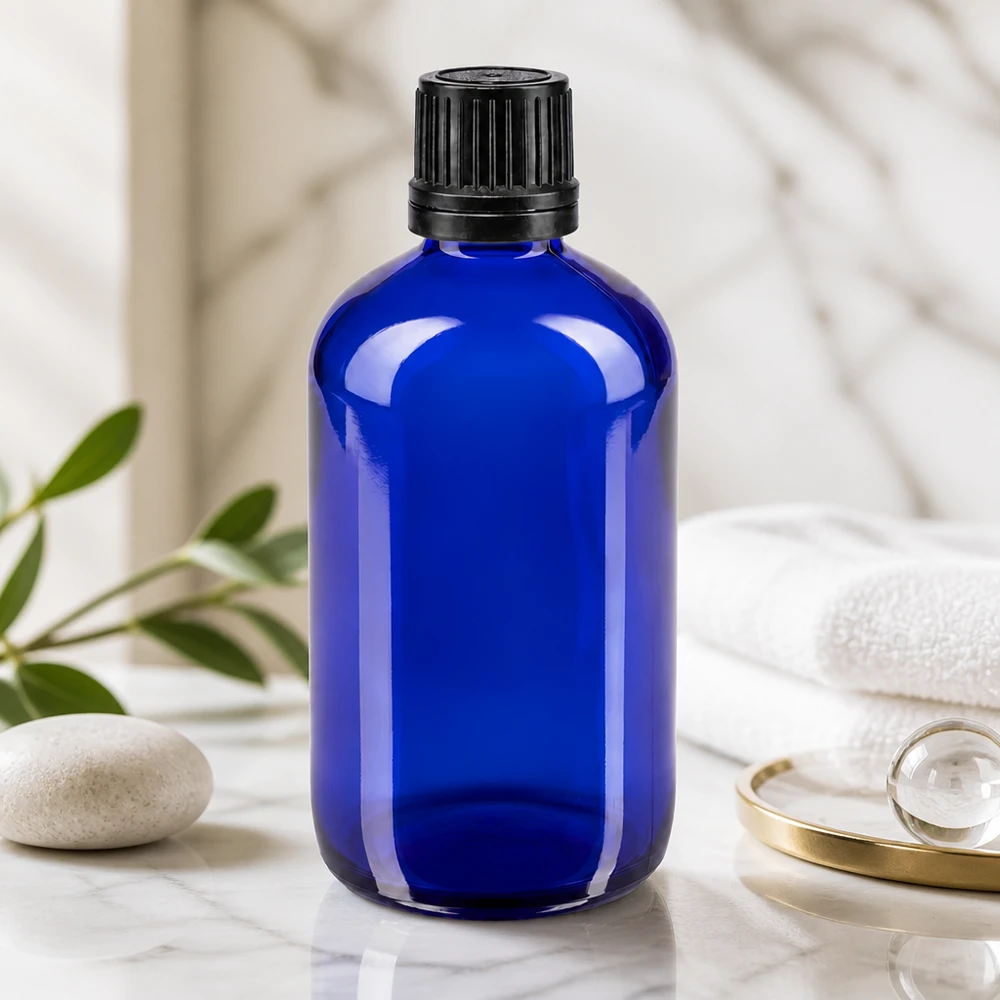 Apothekenflasche blau 100ml Schraubverschluss schwarz Giessring Originalitätsverschluss Runde 100ml blaue Apothekerflasche aus Glas mit schwarzem OV-Verschluss Spa-Ambiente