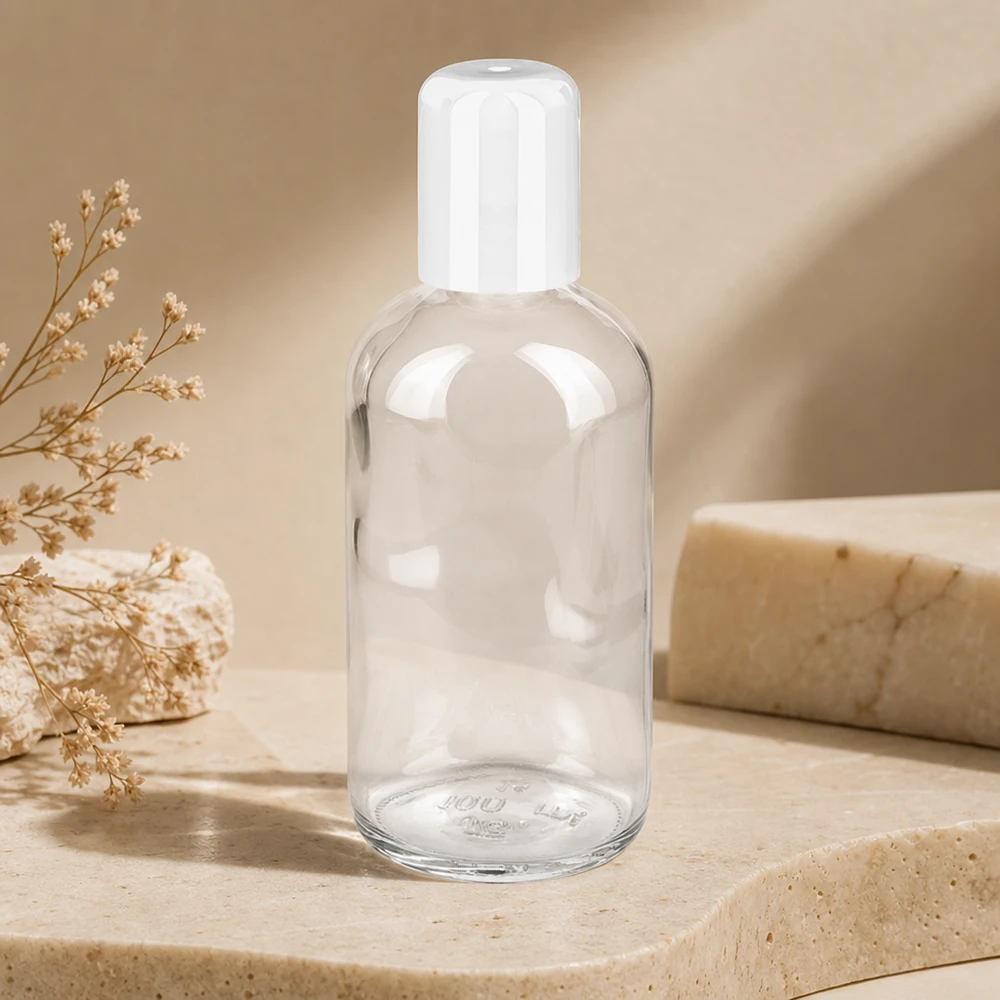 Flacone Roll-On da 100 ml bianco STD ClearLine UT18/100 Flacone roll-on ClearLine vuoto da 100 ml con tappo flip-top bianco su fondo color pietra naturale
